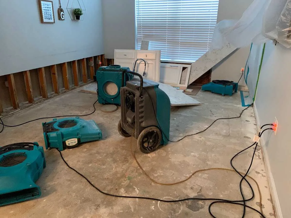 Dehumidifier in flood-cut room for Water Damage Restoration in Silver Spring